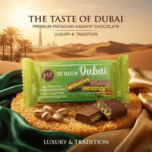 Verpackung der Elit Taste of Dubai Schokolade (90g) neben einem Stück Schokolade mit sichtbarer Füllung aus grüner Pistaziencreme und Kadayif-Fäden.